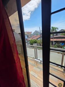 a view from a window of a balcony at Rweydz Guest Inn in Tagbilaran City