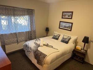 a bedroom with a bed and a window at Mark II 3W in Mount Buller
