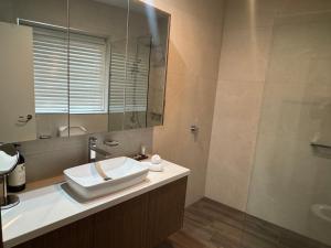 a bathroom with a sink and a mirror at Mark II 3W in Mount Buller