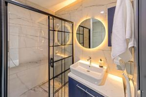 a bathroom with a sink and a mirror at Air Barbaros Hotel Trabzon in Trabzon