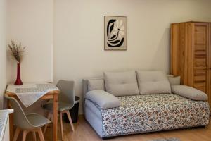 a living room with a couch and a table at Apartment Sučany in Sučany