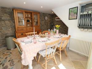a dining room with a table and chairs at The Museum in Alston