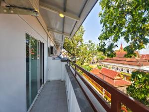 a balcony with a view of a temple at Tiffany Resident Apartment in Siem Reap