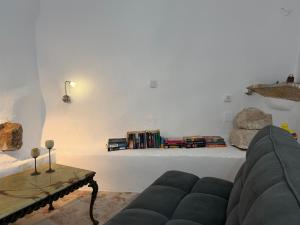 a living room with a couch and a table at Patrick's Traditional Home in Pyrgi