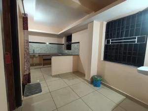 a small bathroom with a sink and a window at Gokula Arcade in Subrahmanya