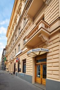 a building with a sign on the side of it at Brezina Pension in Prague