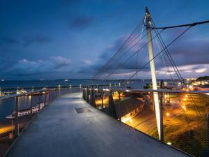 a bridge over a body of water at night at Villa Am Steinbach in Sassnitz