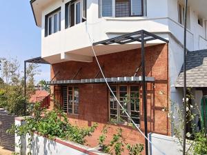 an external view of a house at Coorg rest house in Madikeri