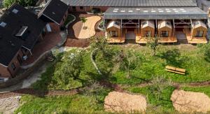 an aerial view of a house with a yard at De Buitenkamer in Rijssen +6 photos