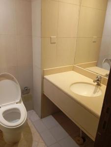 a bathroom with a toilet and a sink at Room Al-Malaz in Riyadh