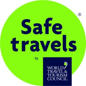 a green sign with the words safe travels on it at Little Dunbar in Dumfries +1 photo