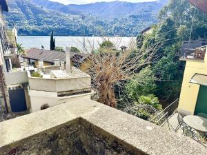 a view from the balcony of a house with a view of a lake at Laglio Cloud Nine, Como Lake in Laglio