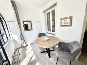 a room with a table and two chairs and a table at Laglio Cloud Nine, Como Lake in Laglio