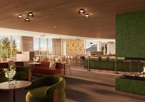 a restaurant with green chairs and tables and a bar at Ganis Resort in Nova Ponente