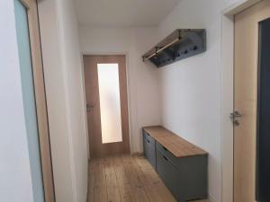a hallway with a door and a table in a room at Apartment Alpenblick Lienz in Lienz
