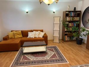 a living room with a couch and a coffee table at Zen House u Poděbrad - Kanín in Poděbrady