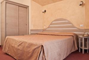 Postel nebo postele na pokoji v ubytování Hotel Nedy