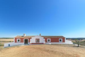 a house in the middle of a field at mount of the two paths in Santiago do Cacém