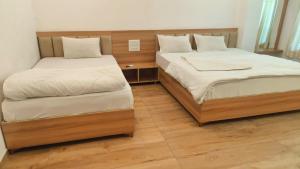 two beds sitting next to each other in a room at Fairview Anayaa in Khātu +30 photos