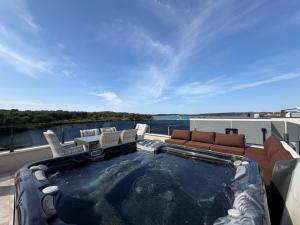 a swimming pool on the roof of a house at Apartman Moonlight Medulin in Medulin
