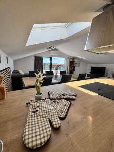 a kitchen table with two plaid napkins on it at Apartman Moonlight Medulin in Medulin