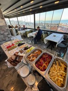 a buffet of food on a table in a restaurant at City Hall Apart Hotel Sultanahmet in Istanbul