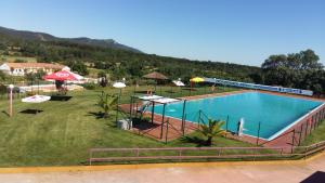 an overhead view of a swimming pool in a field at Quinta da Mina in Monsanto