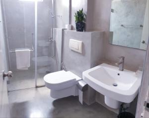 a bathroom with a toilet and a sink and a shower at MountBaylk in Mount Lavinia +58 photos