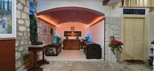 a hallway with an archway and a fireplace in a building at Apartments Giron in Dubrovnik