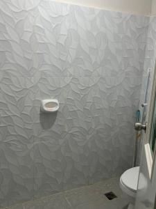 a bathroom with a shower stall with a toilet at Private Villa in Masbate +8 photos