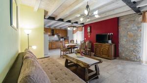 a living room with a couch and a table at Villa Sabrane by Villas Guide in Bale