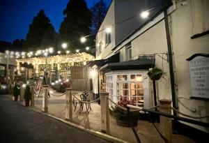 a building lit up at night with lights at Tyr Winch in Cardiff