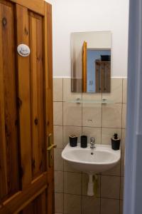 a bathroom with a sink and a mirror at Apartment Sučany 3 in Sučany