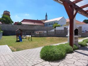 a yard with a playground with a swing at Saeli Apartments in Mikulov