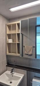a bathroom with a sink and a mirror at 광안리 오션뷰 in Kwangan-dong +11 photos