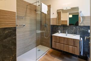 a bathroom with a sink and a shower at Villa Decimum in Ciampino +73 photos