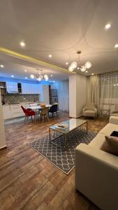 a living room with a couch and a table at Casa hermosa draria in Draria