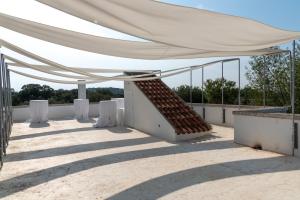 a large white tent on top of a roof at Masseria Noja in Noci +18 photos