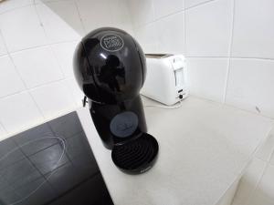 a black mixer sitting on a counter next to a toaster at PARRA HOME y Garaje, Algemesi Home in Algemesí