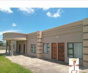 a large building with two doors on the side at Ayjalon Guest Home in Ludeke