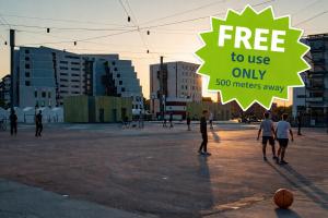 a group of people playing basketball in a parking lot at PAK Central apartment Odense C in Odense