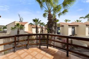 a view from the balcony of a house with palm trees at Casa del Jable in Parque Holandes