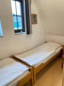 Postel nebo postele na pokoji v ubytování Finnhaus Andrea