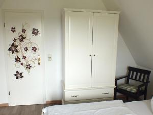 En eller flere senge i et værelse på Finnhaus Elke