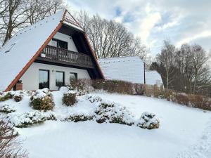 a house with a roof covered in snow at Finnhaus Lisa in Marlow