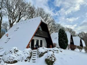 a house with snow on the roof at Finnhaus Annika in Marlow