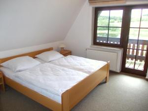 Llit o llits en una habitació de Finnhaus Brigitte