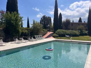 a swimming pool with a toy in the water at Podere Fignano, holiday home - apartments renovated 2024 - new swimming pool in Montaione