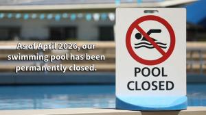 a sign in front of a swimming pool at Pension Mountain View Sauerland in Winterberg