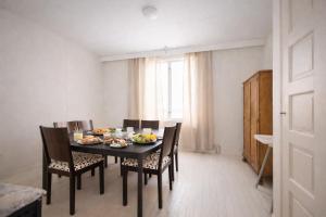a dining room with a table with food on it at Kristillan kartano in Tampere +10 photos